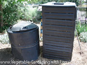 2 top to bottom composters at a community garden 2 top to bottom composters at a community garden